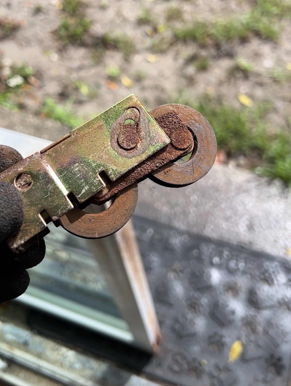 Old rusted roller assembly removed during replacement by Bayfront